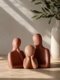 In Harmony handcrafted terracotta family sculpture — father, mother and child figures