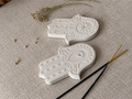 Hamsa incense holder flat lay showing two pieces