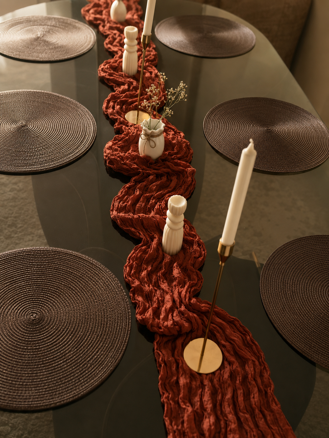 Ember table set – terracotta red crinkle runner with dark woven placemats overhead view