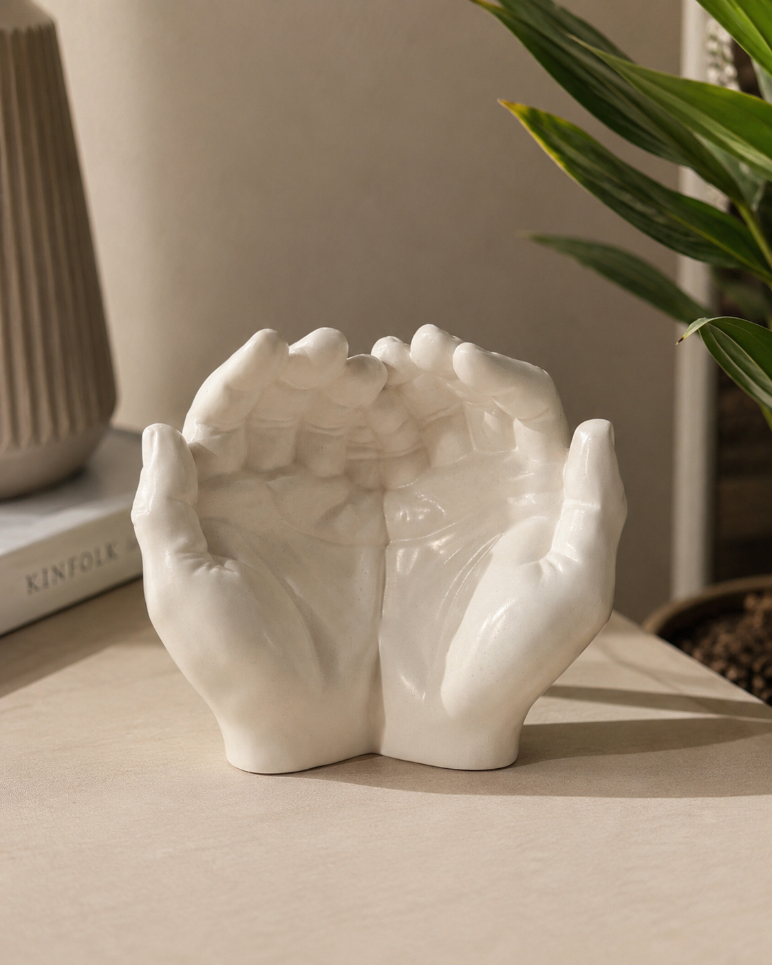 The Giving Hands duo cupped hands sculpture