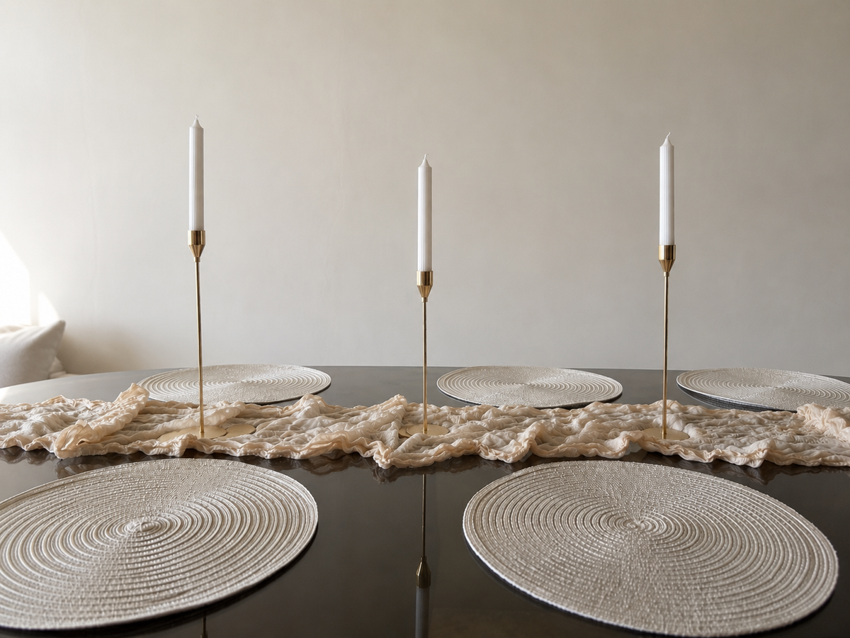 Linen Wave table runner with gold candleholders and woven placemats