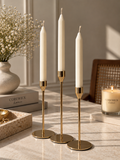 Gold candlestick set of 3 with classic white taper candles styled with CoreWick candle
