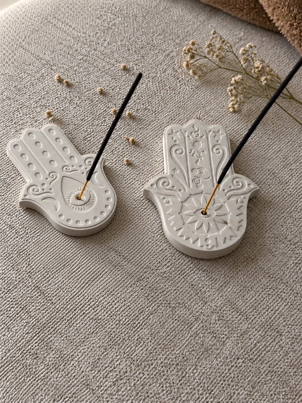 Hamsa incense holders with incense sticks