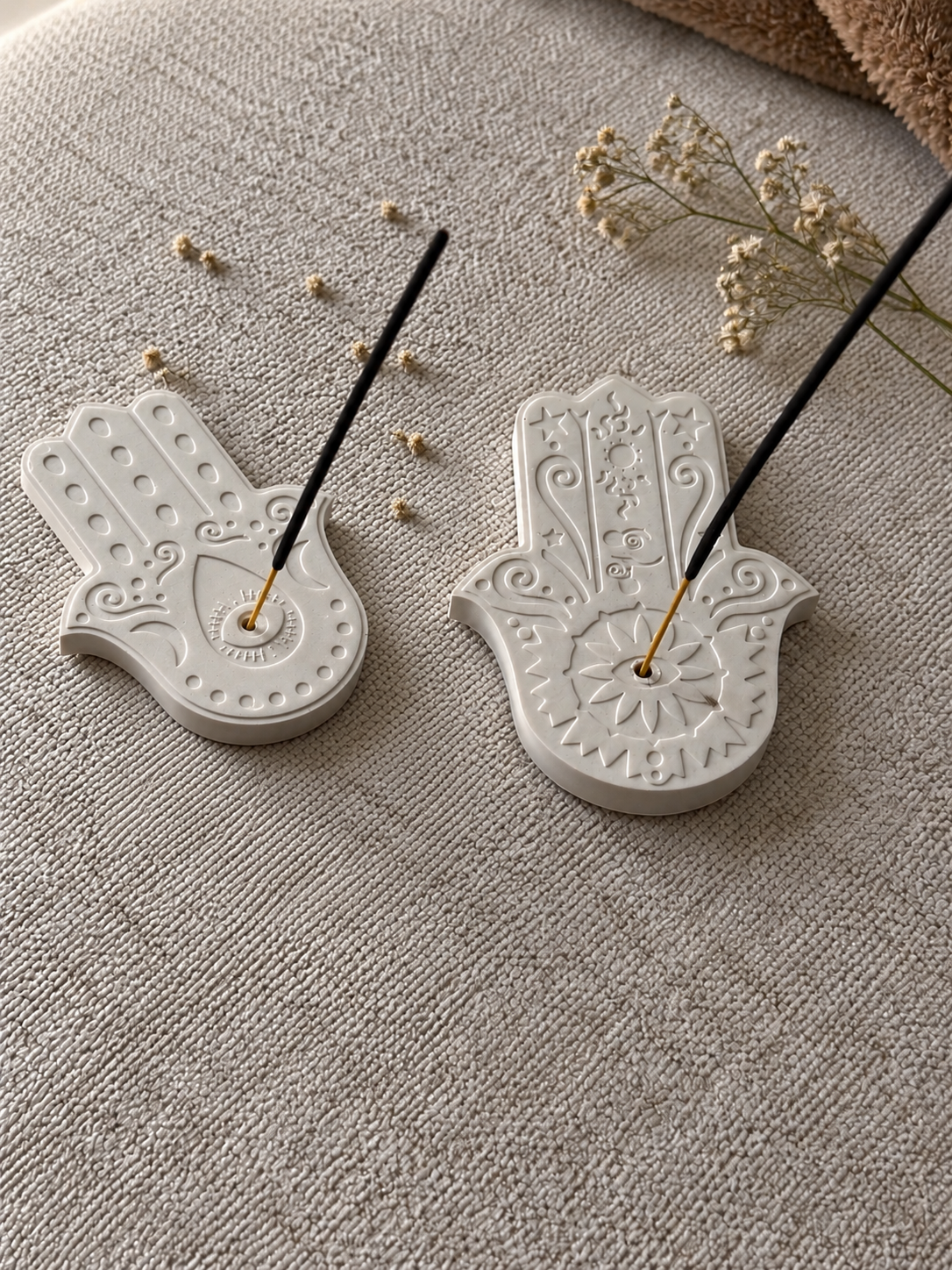 Hamsa incense holders with incense sticks